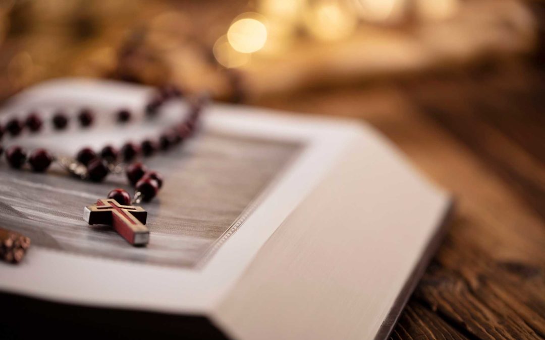 A rosary with bible