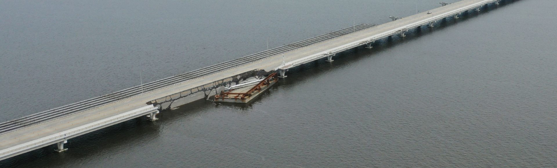 3-mile bridge, or Pensacola Bay Bridge, after hurricane Sally hit. Skanska (a construction company) had barges near the bridge, resulting in the bridge outage. This image shows where the loose barge struck the bridge, taking out the entire bridge.