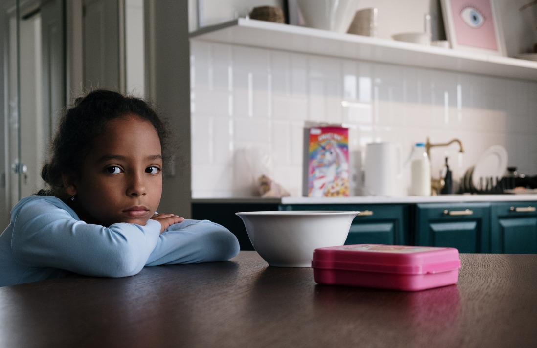 young girl at kitchen table